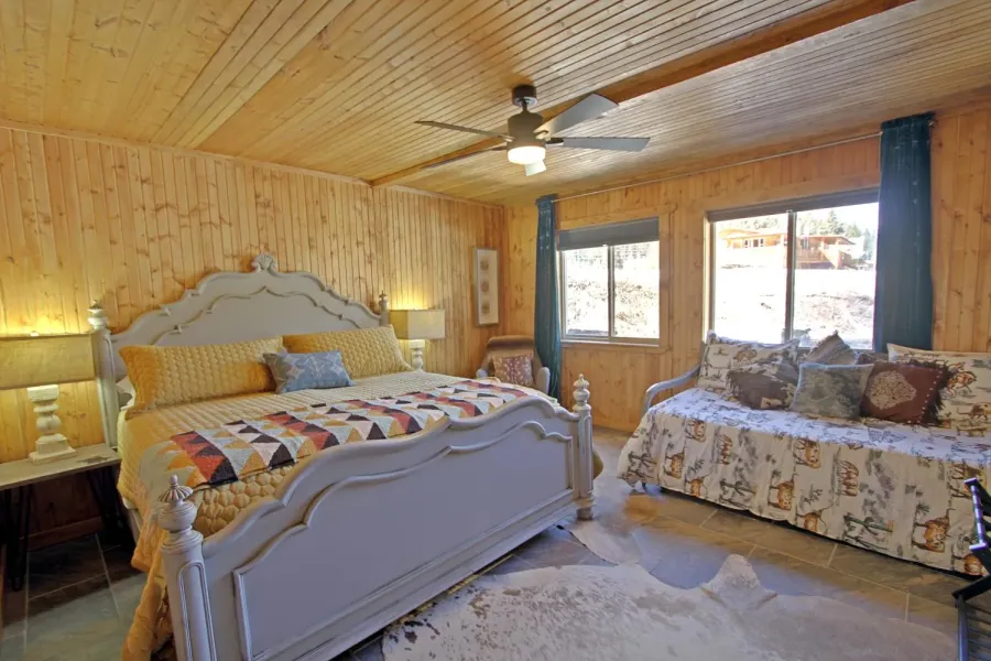 Master Bedroom 1 on the main level has a king size bed and a trundle.