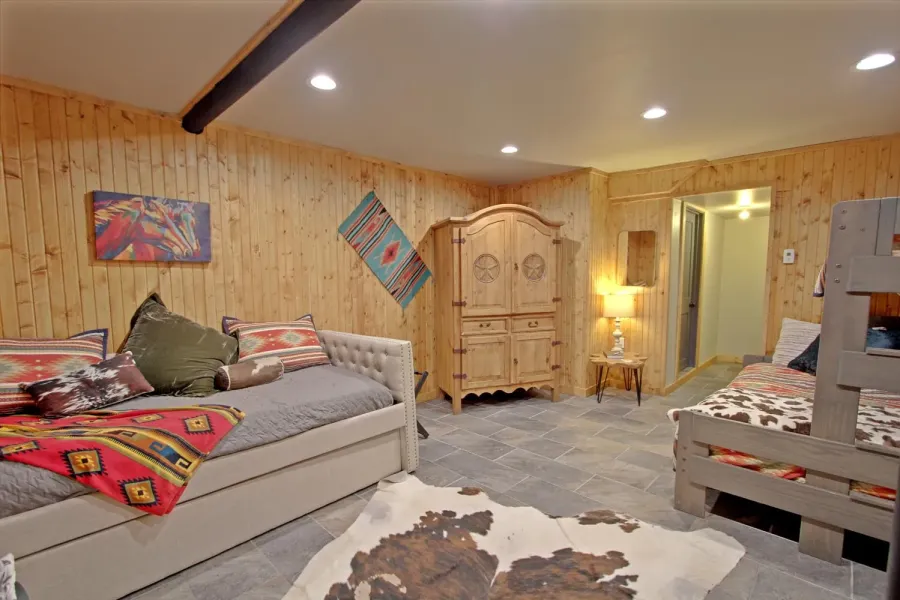 Bunkroom has a queen over twin bunkbed, trundle bed & bathroom. 