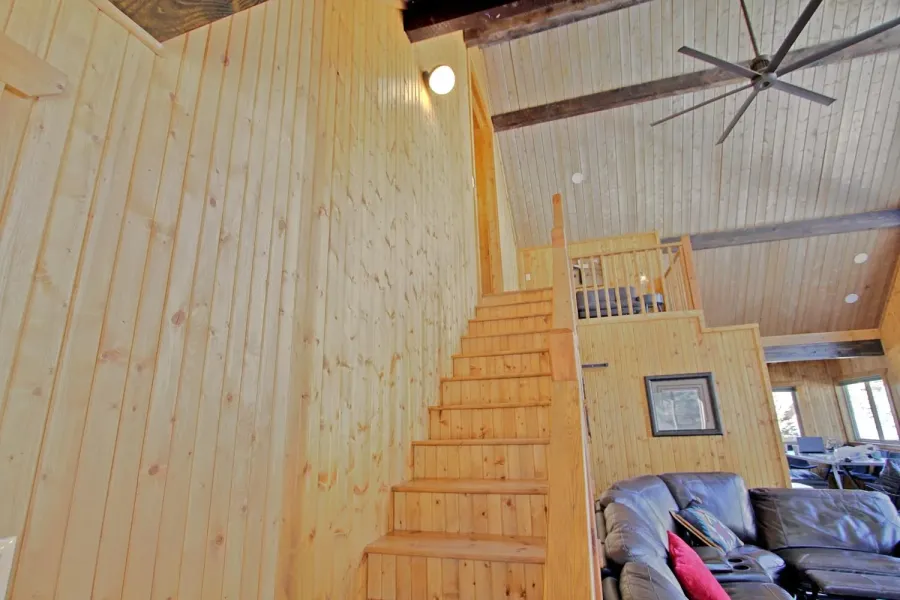 The stairway leading up to the upper level.